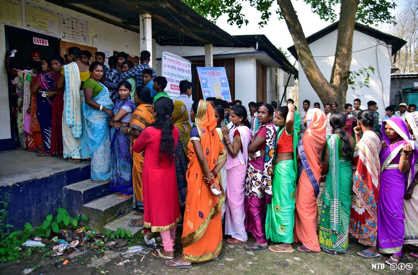 Women wait in queues to cast their votes outside a polling station during the 2019 Indian general election. Photographer: Anuwar Hazarika, NTB